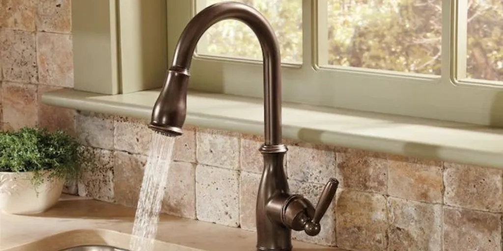 Illustration: cleaning an oil rubbed bronze kitchen faucet with a soft cloth